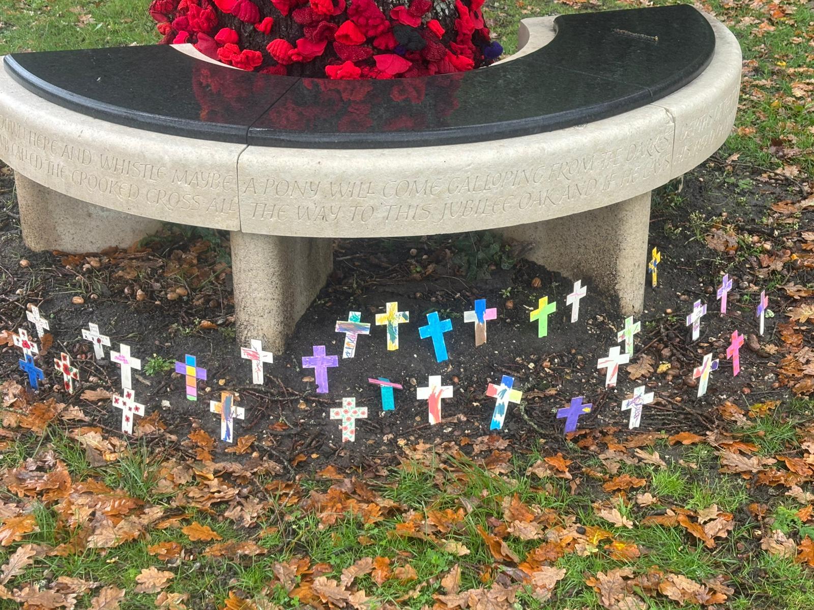 memorial bench with crosses