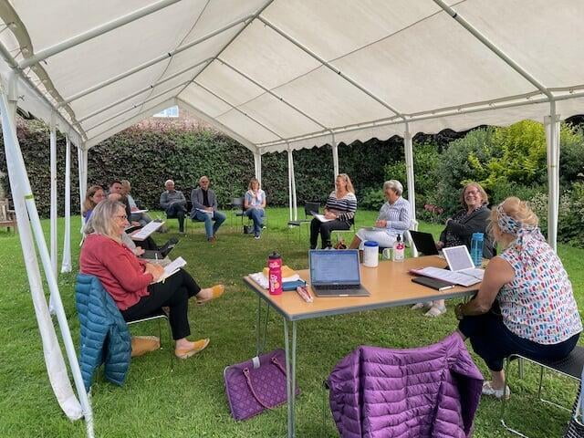 Councillors meeting under a gazebo